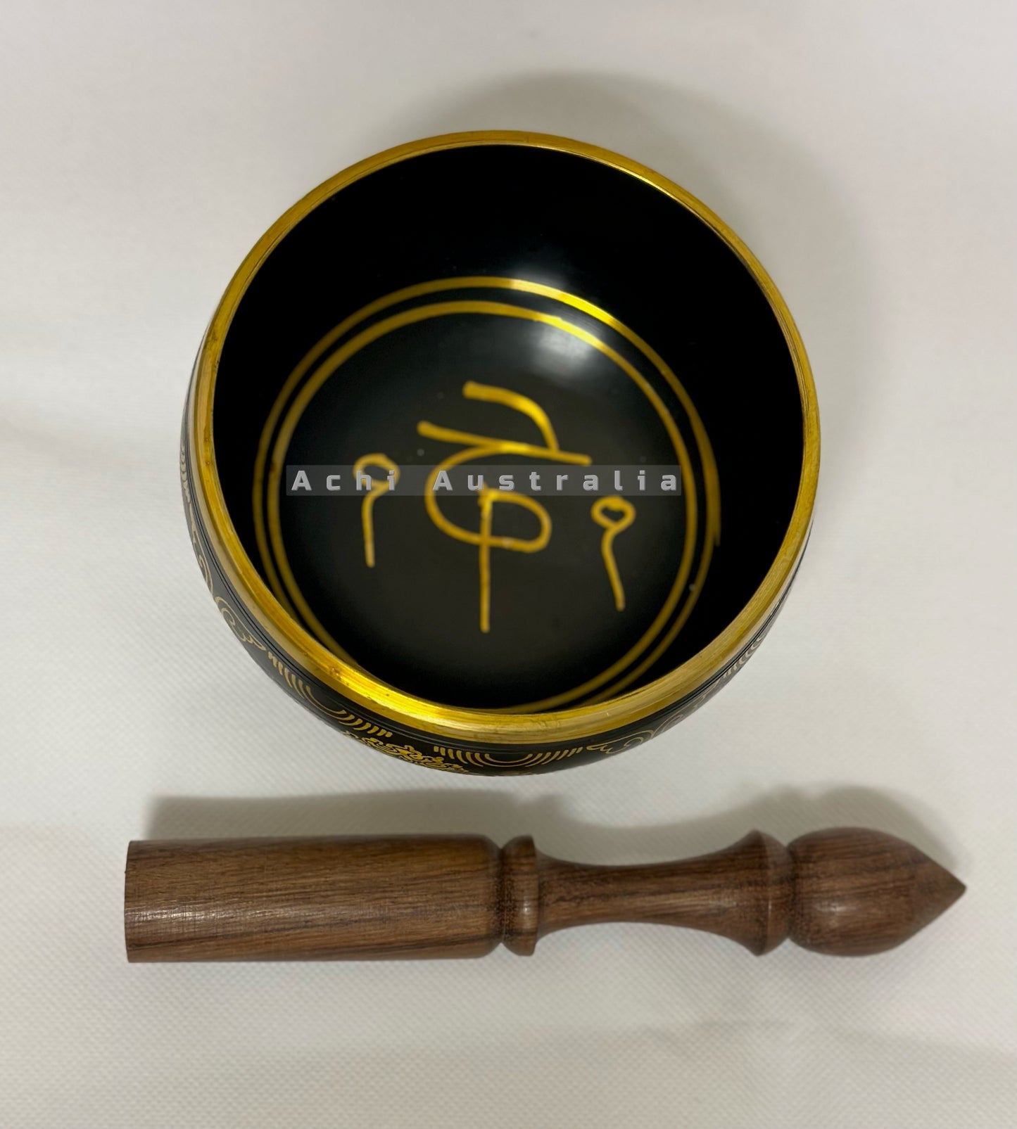 Black Singing Bowl with Mantra symbol.