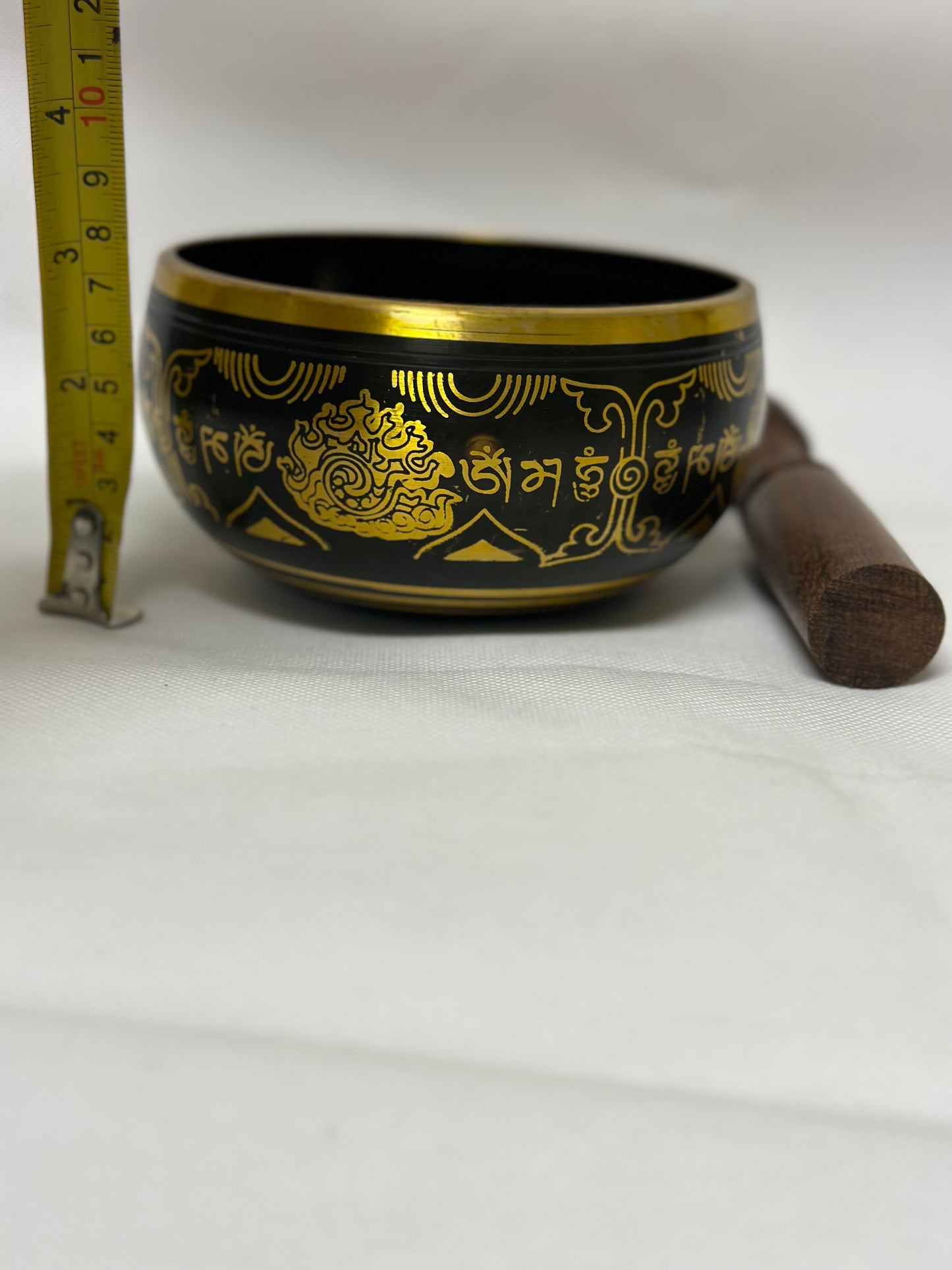 Black Singing Bowl with Mantra symbol.